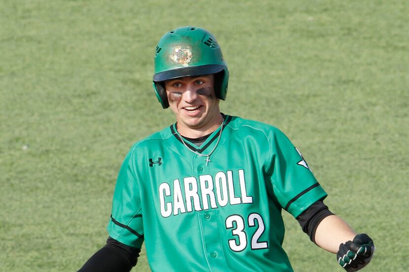 Southlake Carroll infielder Nik Millsap (32) celebrates his 2-RBI double during the top of...