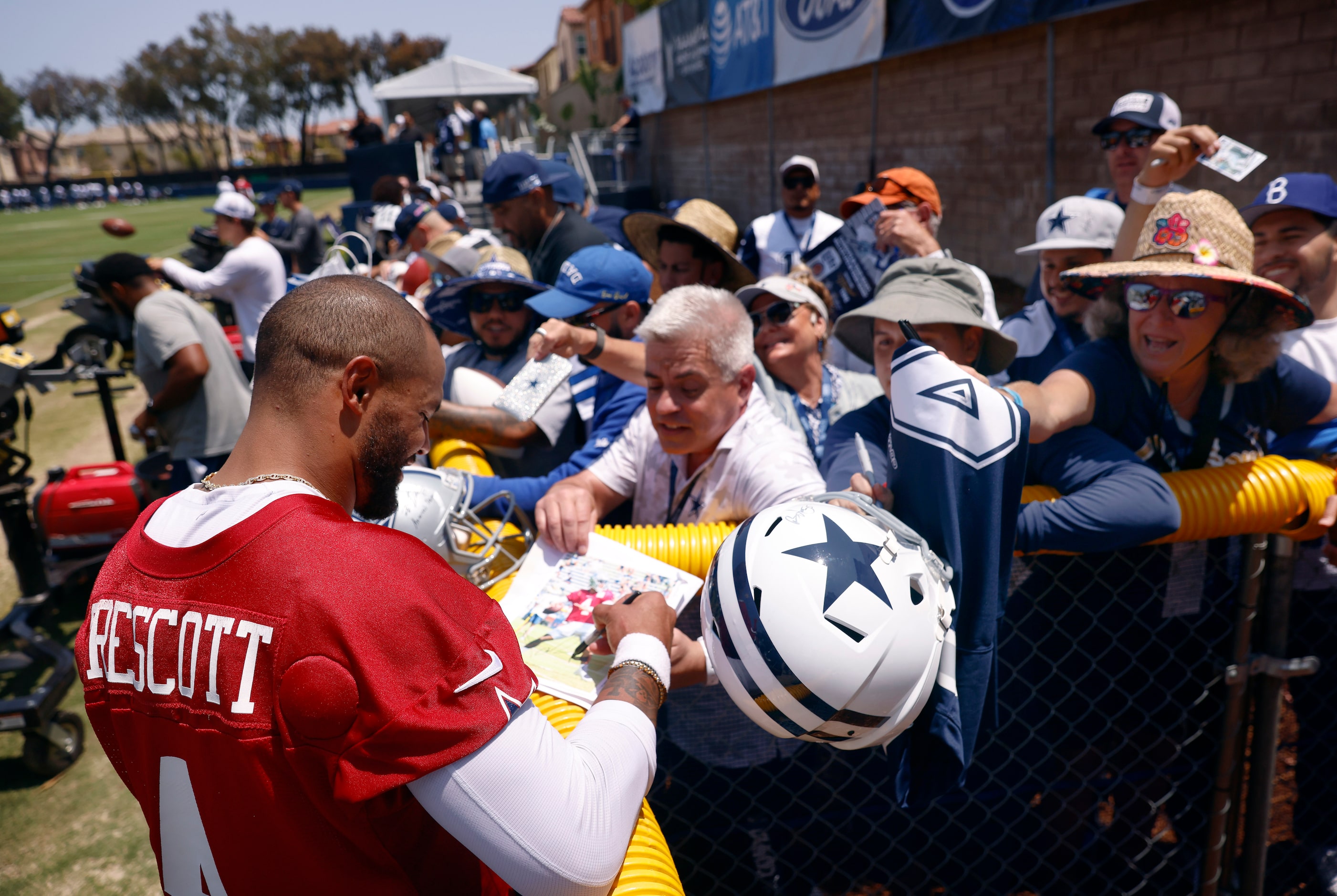 Dallas Cowboys quarterback Dak Prescott (4) signs autographs for fans following the  opening...