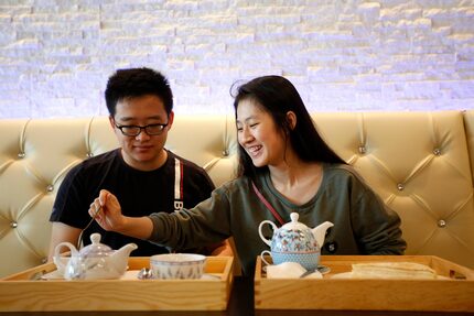 Calvin Tse, left,  and Pingping Cui check out Mango Mango Dessert on March 25, 2017.