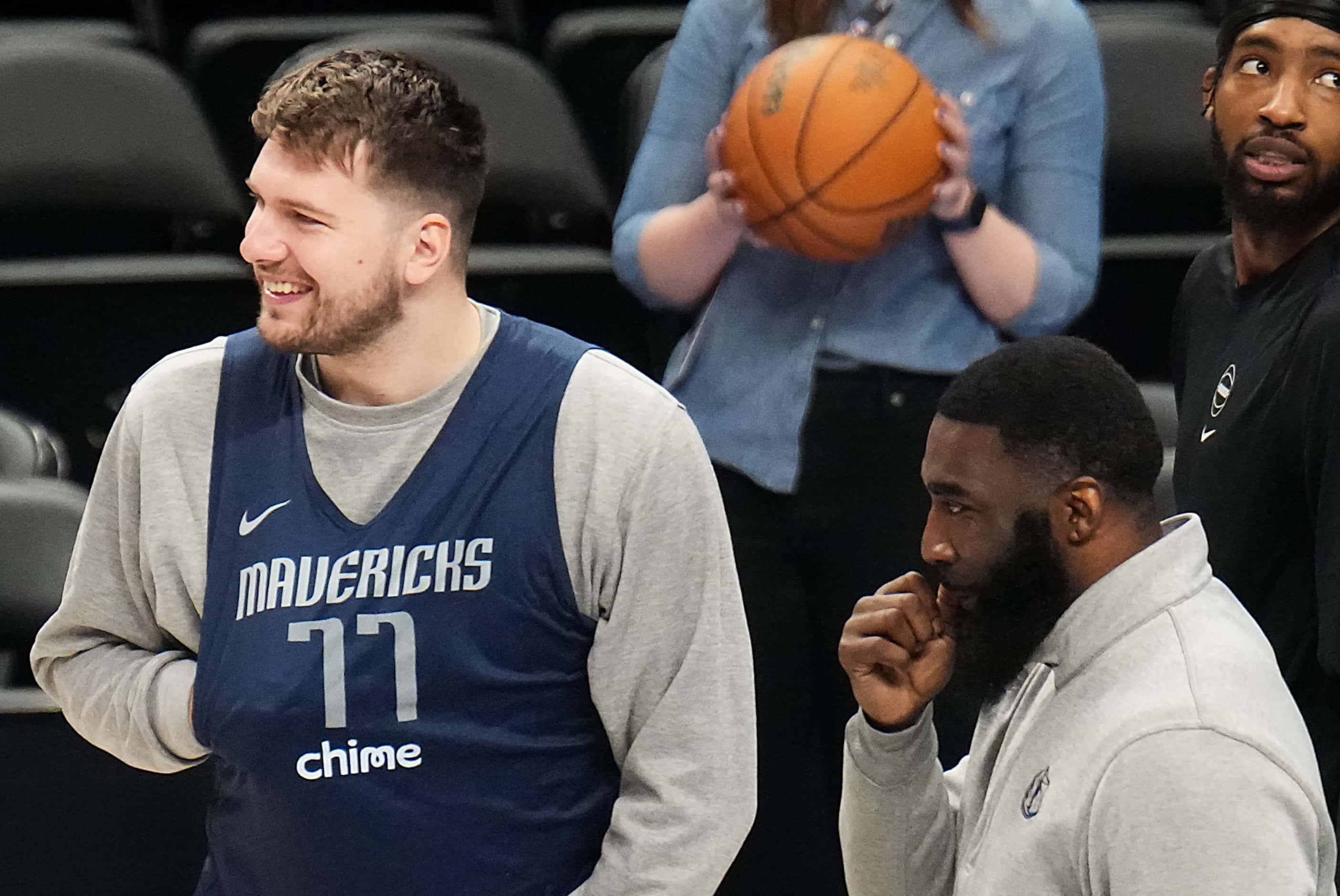 Dallas Mavericks guard Luka Doncic holds his hand on his chest during practice in...