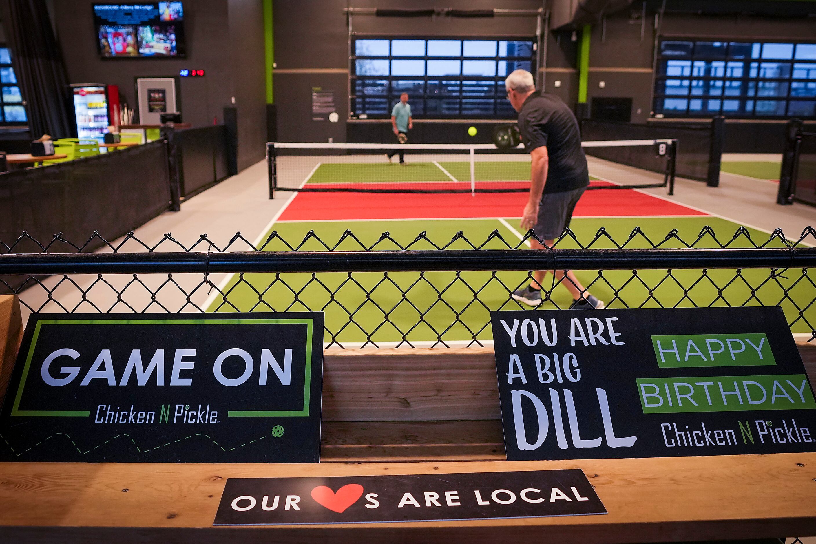 Patrons play pickleball at Chicken N Pickle on Friday, Dec. 9, 2022, in Grand Prairie.