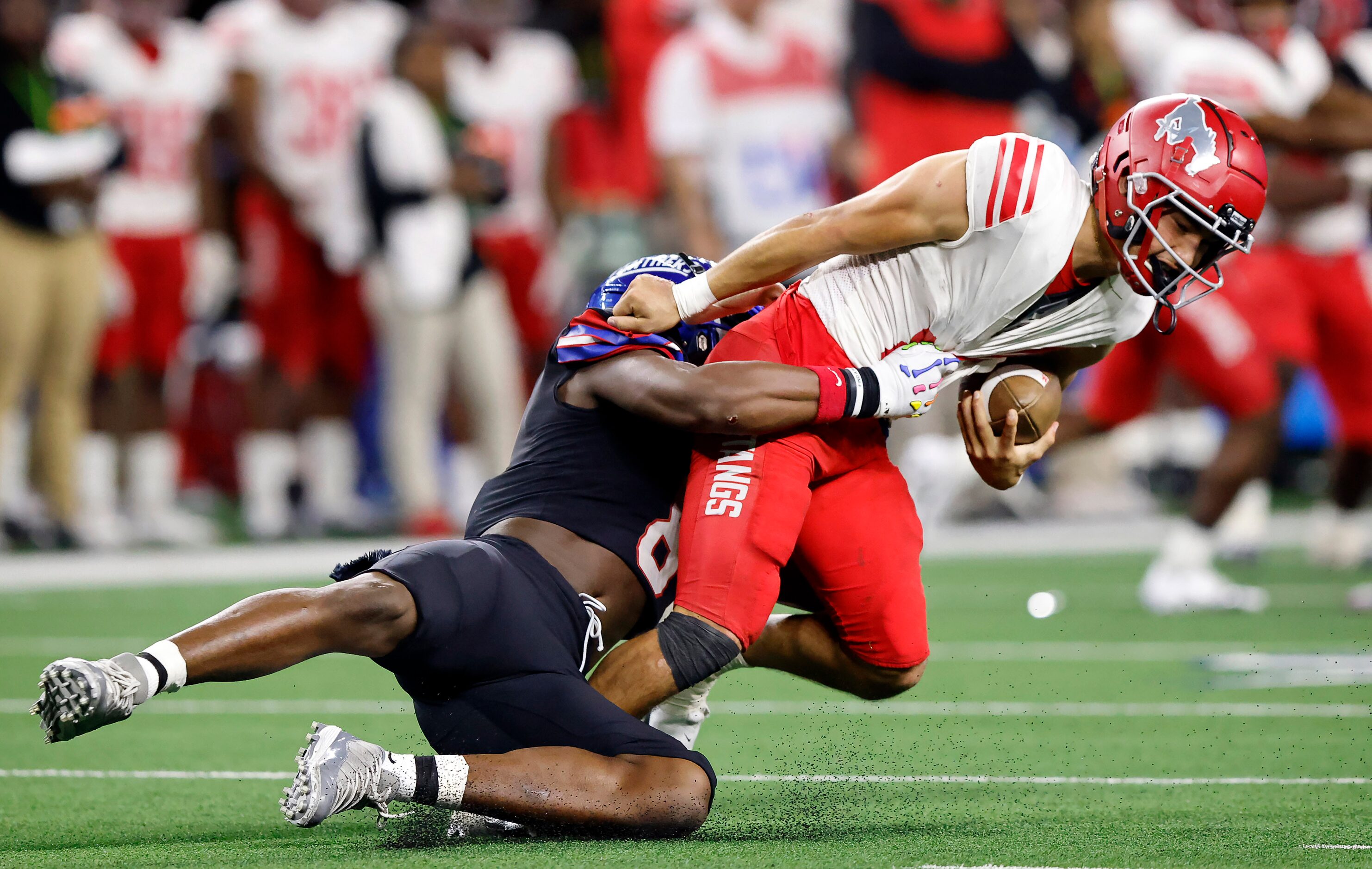 Duncanville linebacker Colin Simmons (8) brings down Galena Park North Shore quarterback...