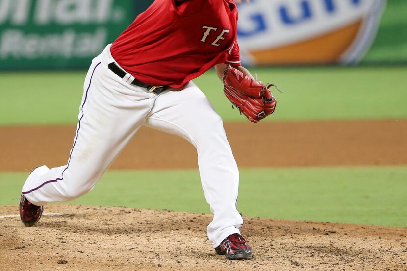 Texas Rangers starting pitcher Yu Darvish (11) strikes out Oakland Athletics left fielder...