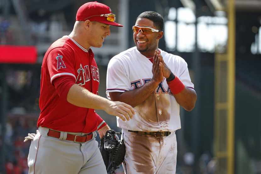 Texas Rangers shortstop Elvis Andrus, right, and Angels outfielder Mike Trout are pictured...