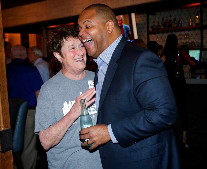 Dallas mayoral candidate and current state Rep. Eric Johnson is congratulated by his...