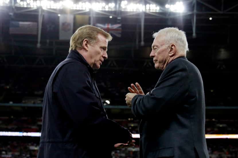 In this Nov. 9, 2014, file photo, NFL Commissioner Roger Goodell, left, and Dallas Cowboys...