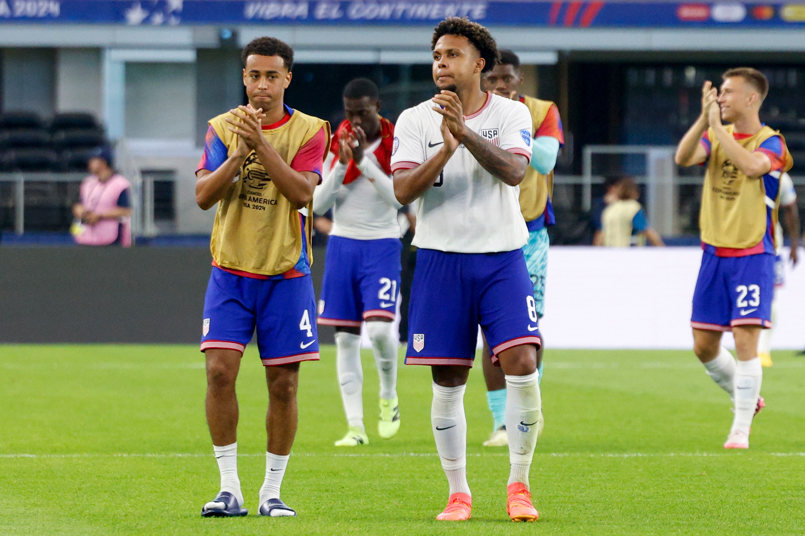 United States midfielders Tyler Adams (4) and Weston McKennie (8) applaud the fans after a...