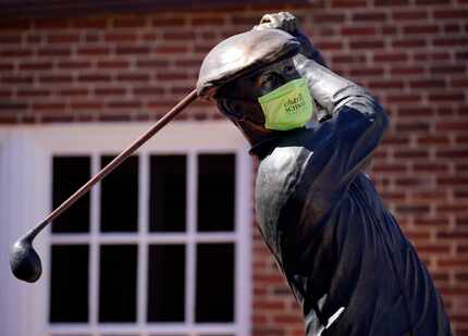 In the wake of COVID-19, the Ben Hogan statue, which greets golfers to the course, bears a...