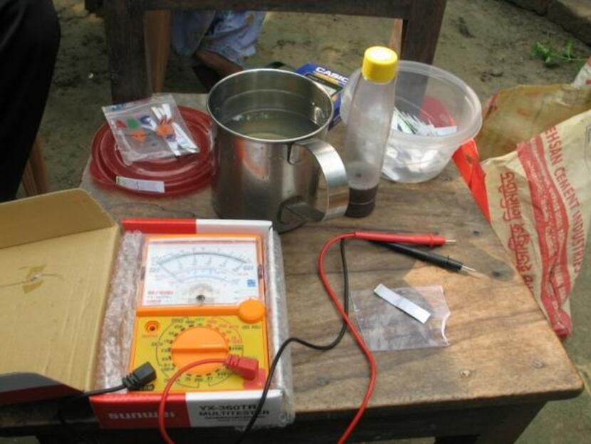 
Pulak’s home-based rapid arsenic water test, shown here in a Bangladesh village, includes a...