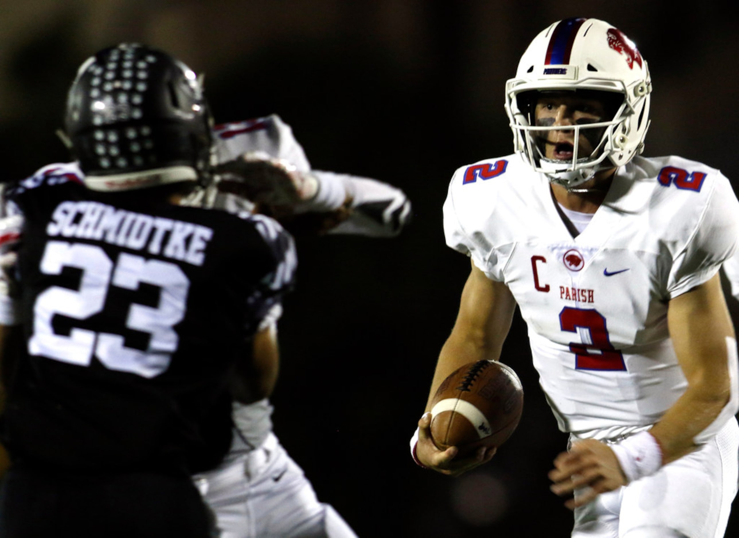 Parish Episcopal quarterback Preston Stone (2) follows his blocks as Bishop Lynch defensive...