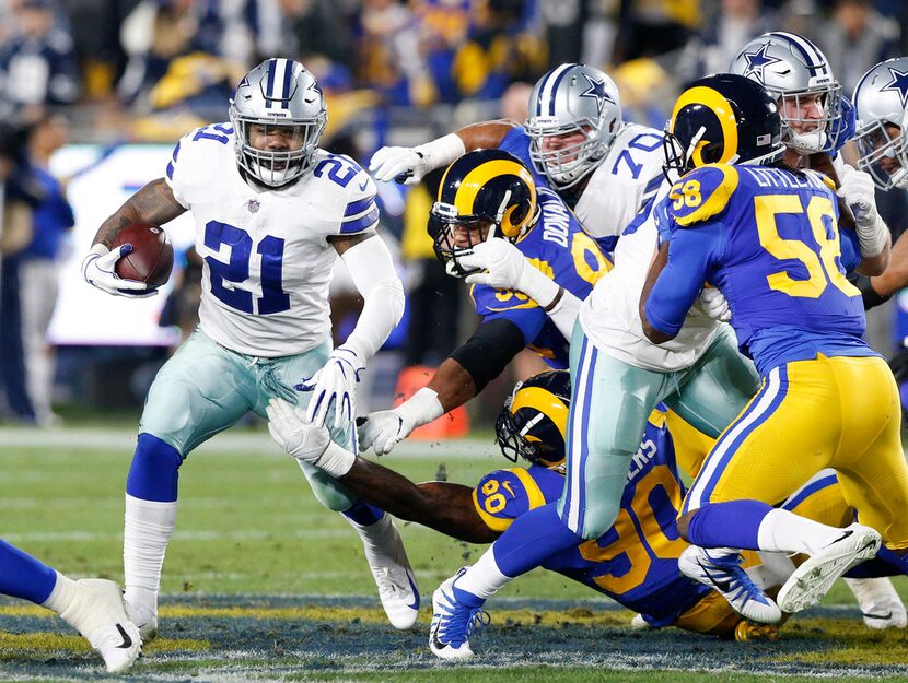 Dallas Cowboys running back Ezekiel Elliott (21) picks up the first down as the Cowboys went...