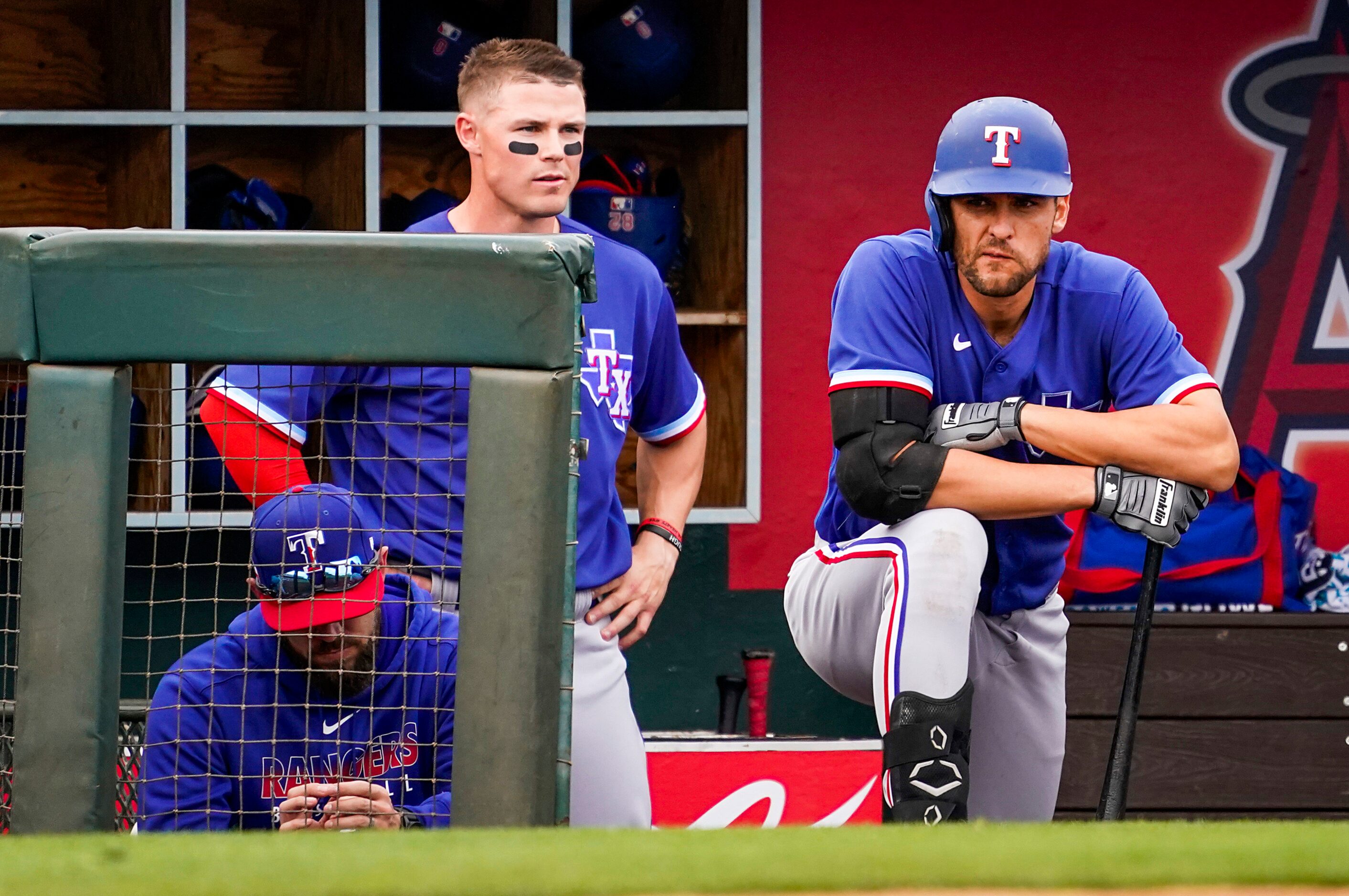 Texas Rangers infielder Greg Bird (right) and outfielder Scott Heineman watch from the...