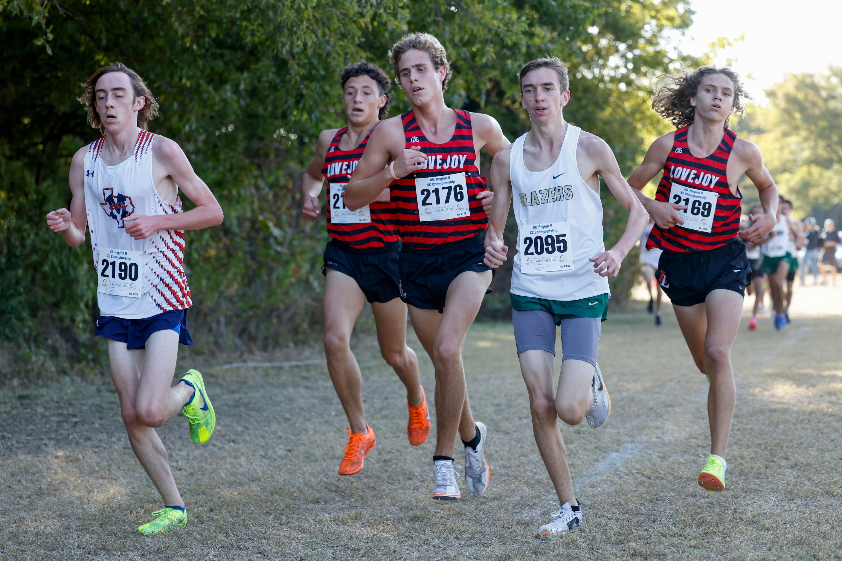 Frisco Lebanon Trail’s Andrew Malan (2095) runs with a pack of Lucas Lovejoy and McKinney...