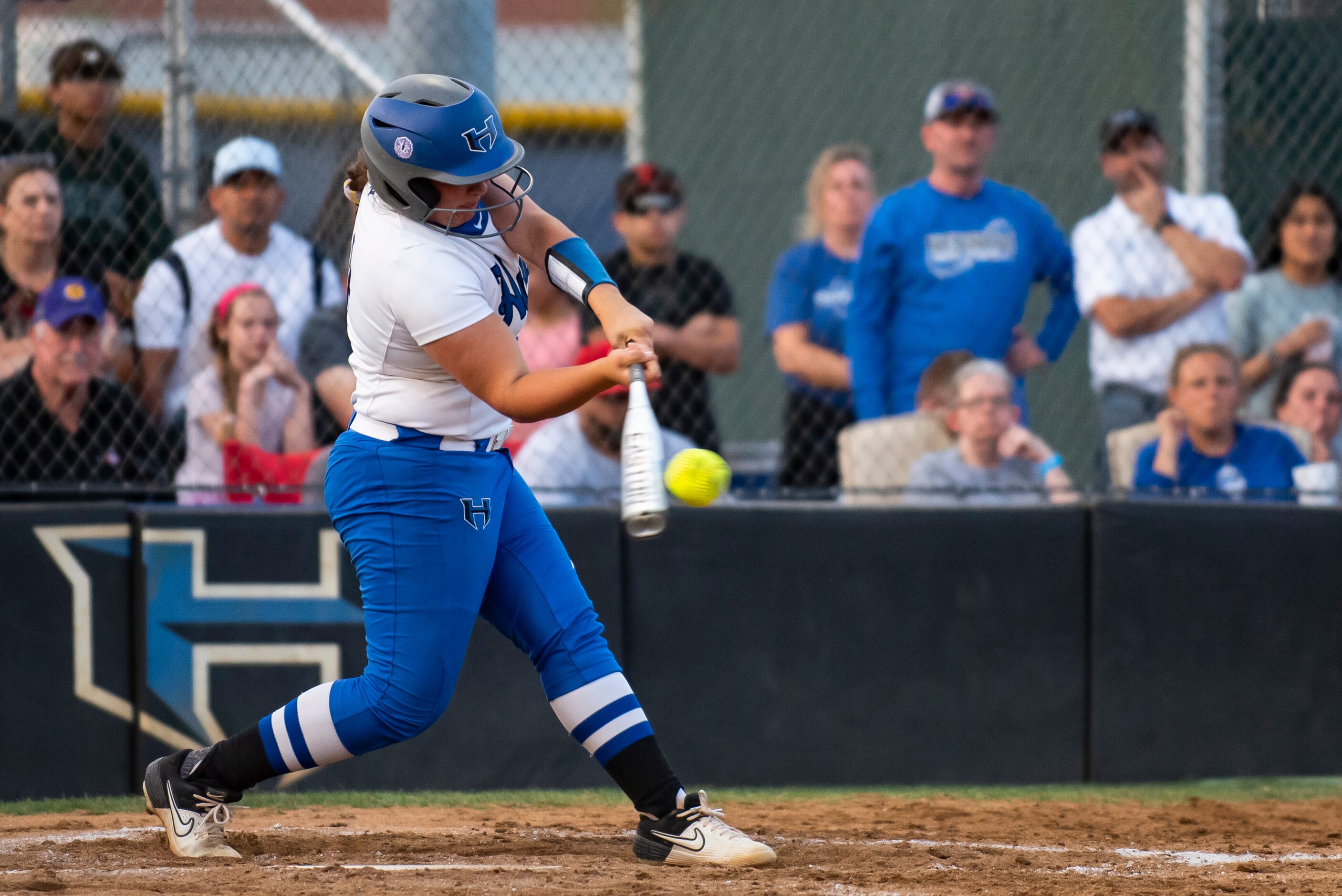 Hebron pitcher Lucy Crowder (14) hits the ball during the District 6-6A title game between...