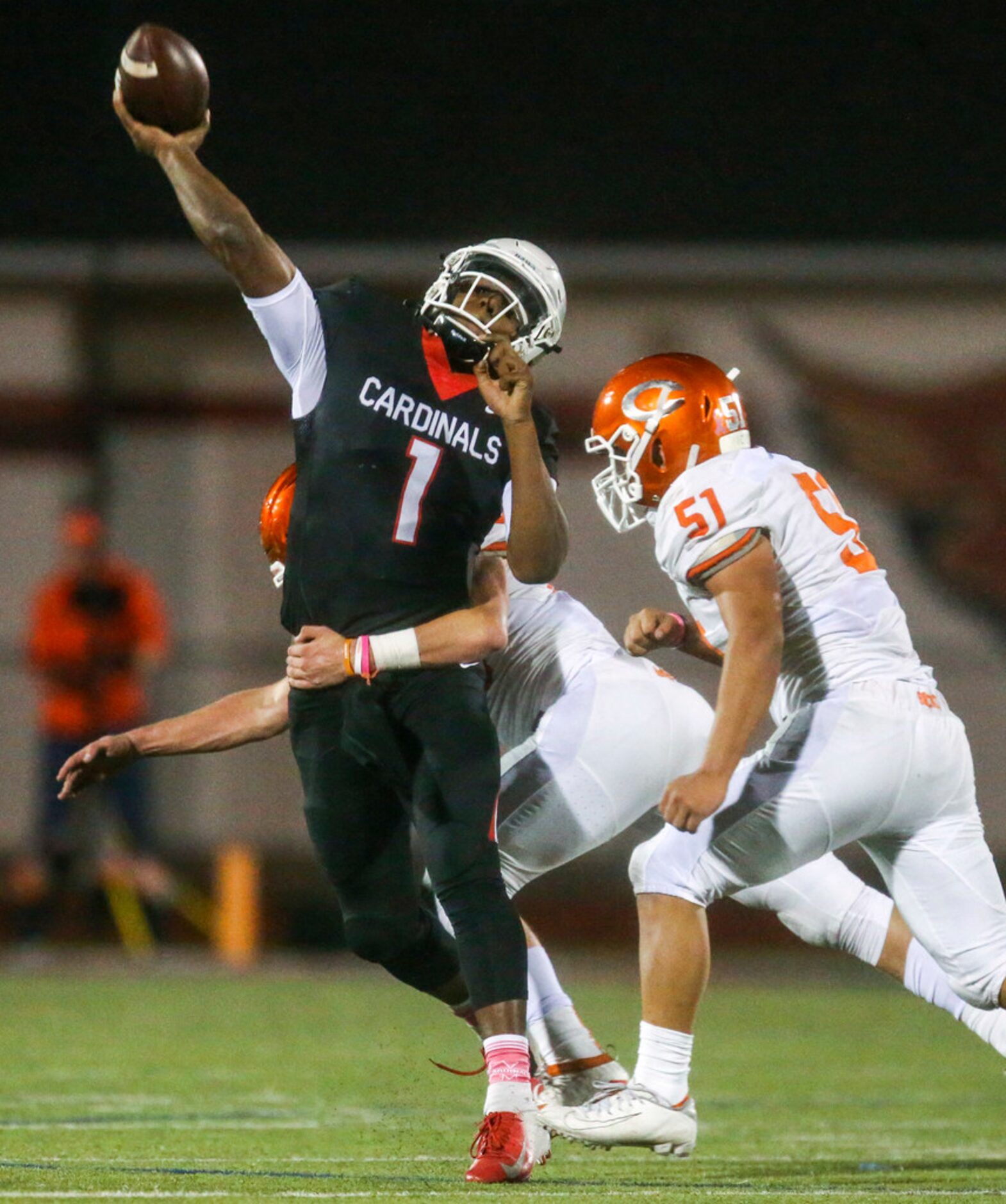 Melissa quarterback Brendon Lewsi (1) makes a pass under pressure from Celina linebacker...