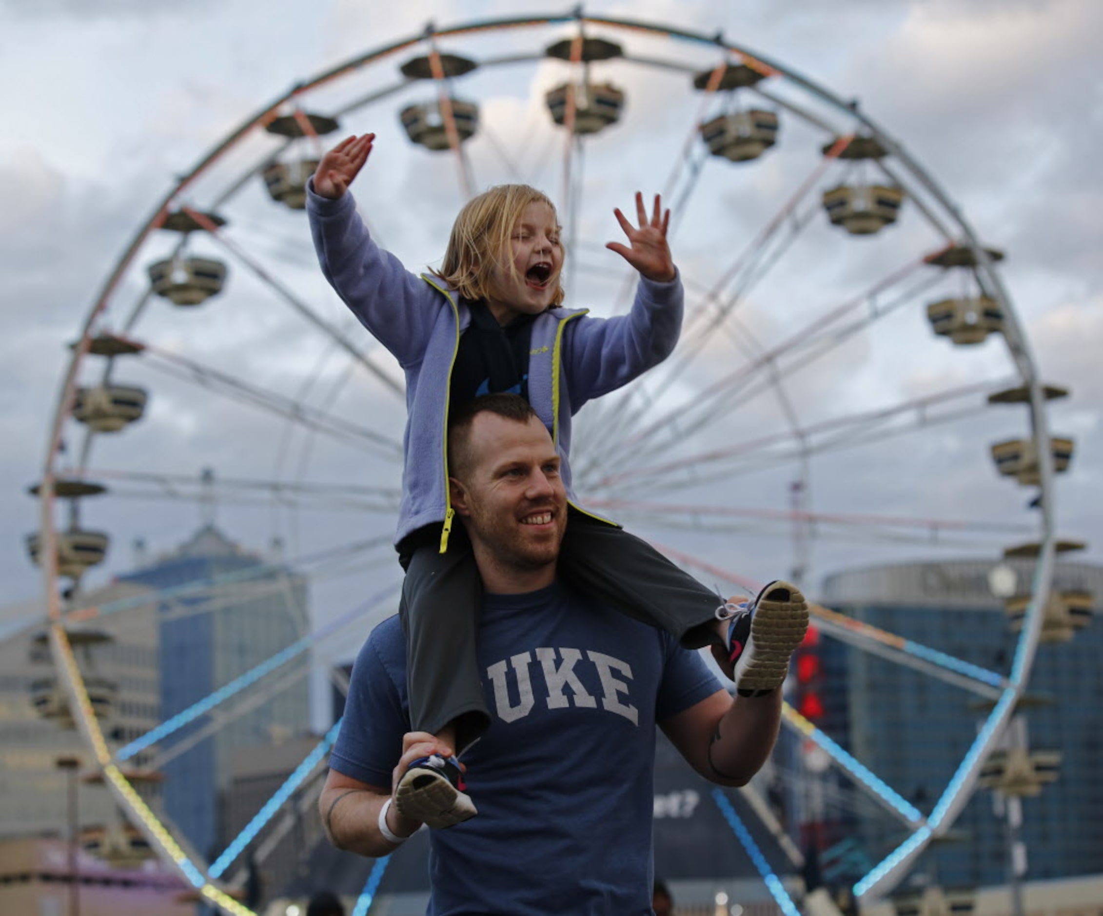 Josh Keithley and his daughter Elizabeth Keithley, 4, dance to The Killers during March...