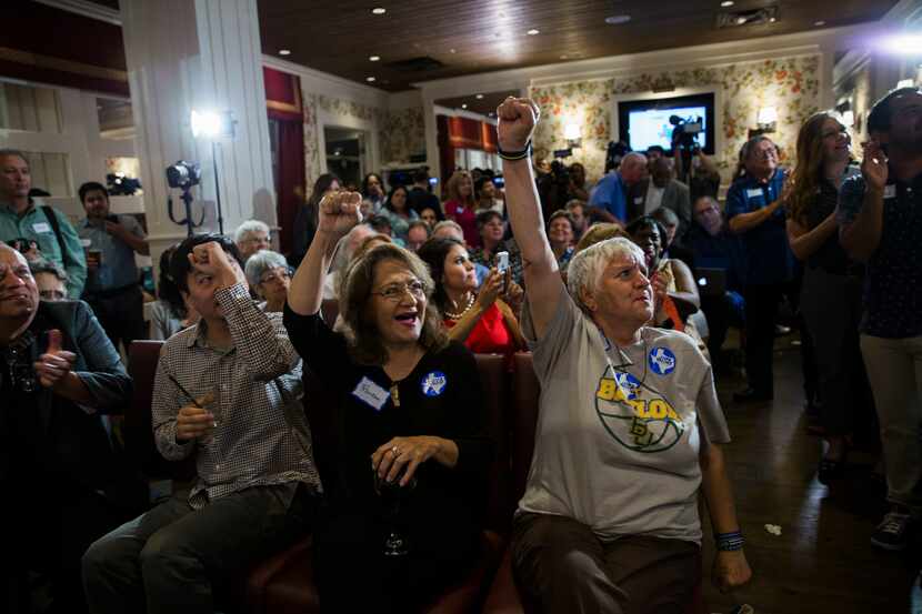 Frances Rizo, center, Sylvia Collins, right, and other supporters of gubernatorial candidate...