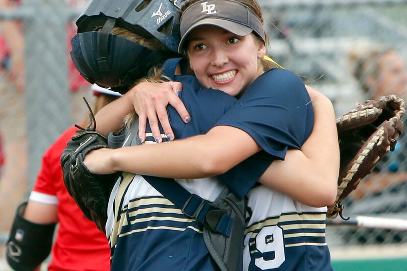 Little Elm pitcher Lauren Lucas (19) celebrates with catcher Georgia Heathcock at the end of...