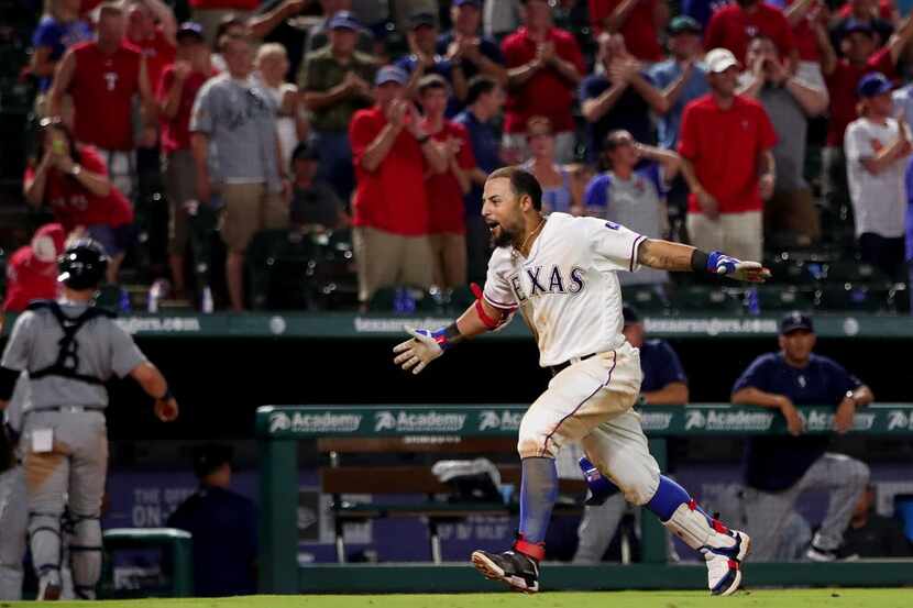 ARLINGTON, TX - AUGUST 30:  Rougned Odor #12 of the Texas Rangers celebrates after hitting a...