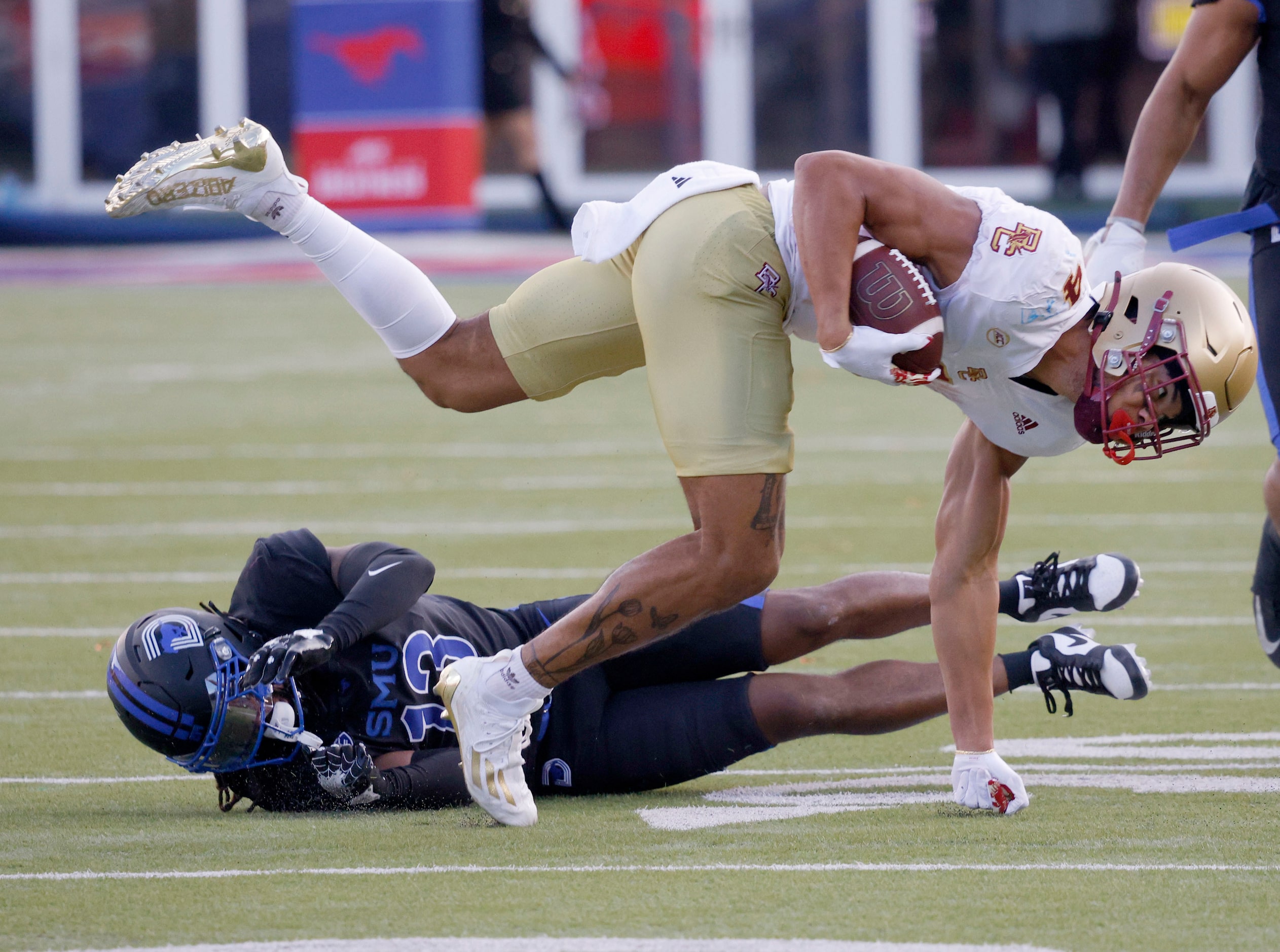 Boston College wide receiver Reed Harris (4) is tackled by SMU cornerback Jaelyn...