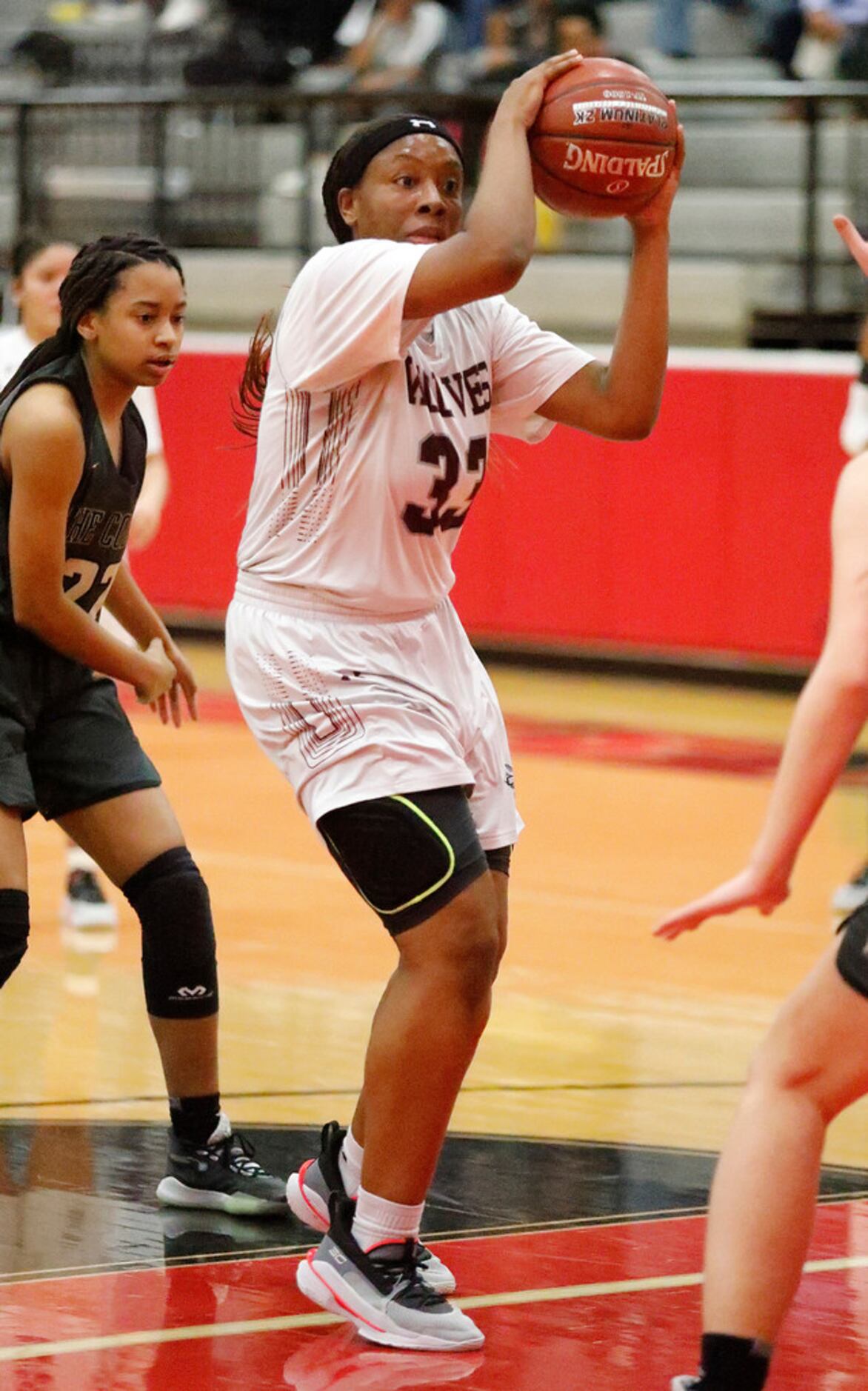 Timberview High School forward Destiny Burton (33) looks to pass from the high post during...