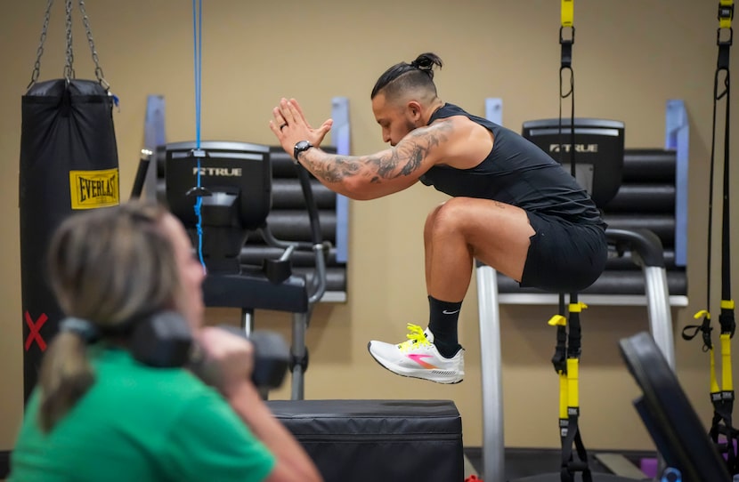 Marcial Marichalar III uses a jump box while working out in the gym at Hill & Wilkinson...