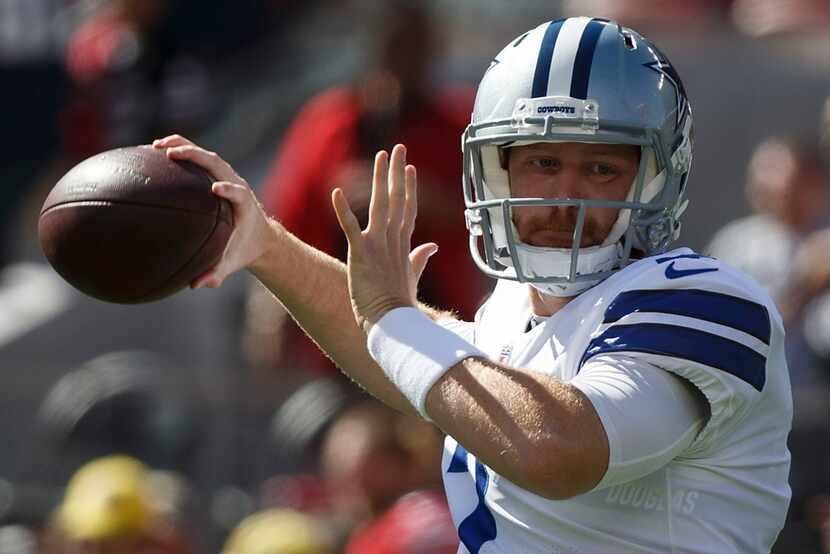 Dallas Cowboys quarterback Cooper Rush (7) warms up before an NFL football game on Sunday,...