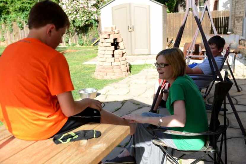 
Allyson Hendrickson talks to her son, Cade, in the family's backyard in Flower Mound.

