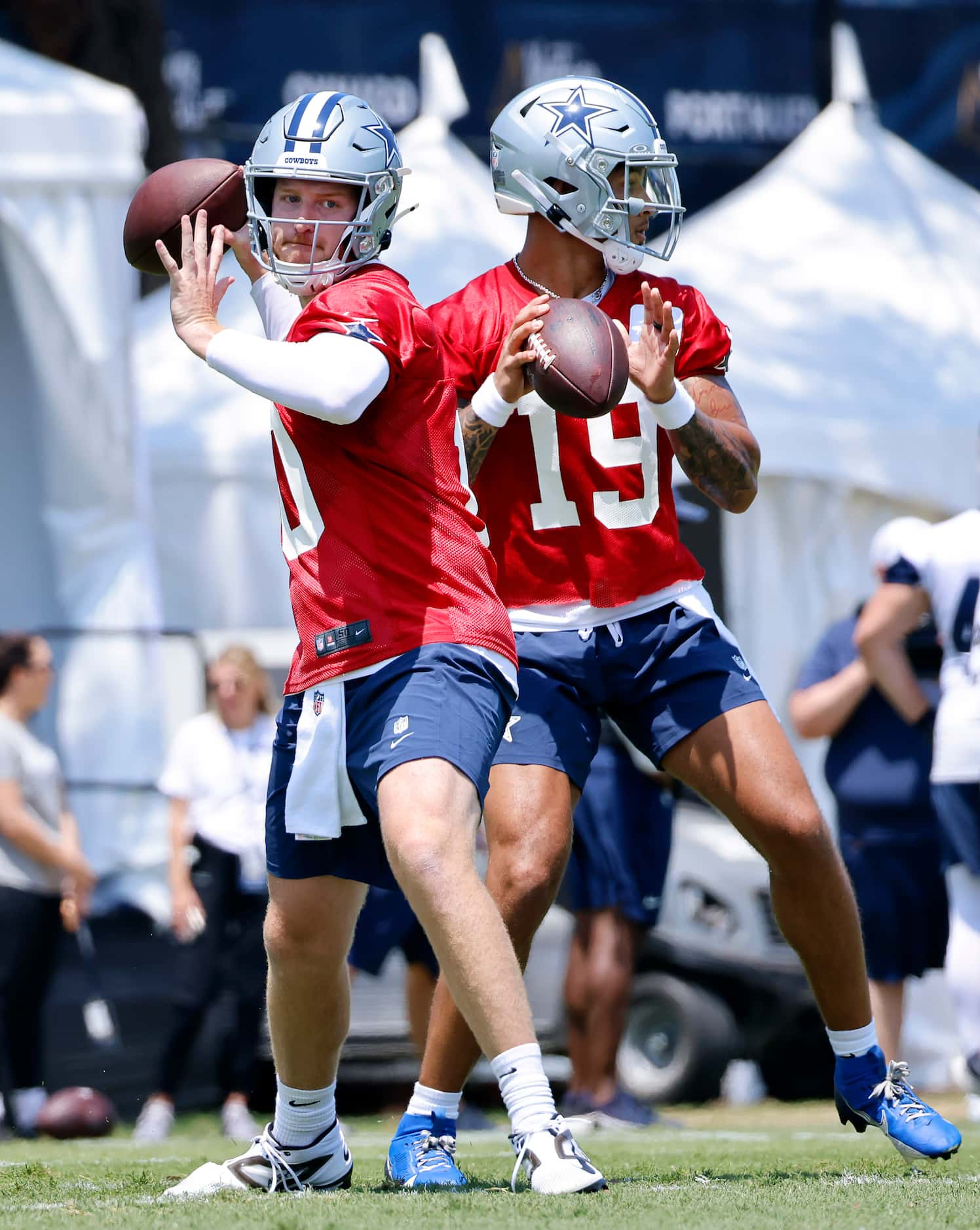 Dallas Cowboys quarterbacks Cooper Rush (10) and Trey Lance (19) throws to receivers during...