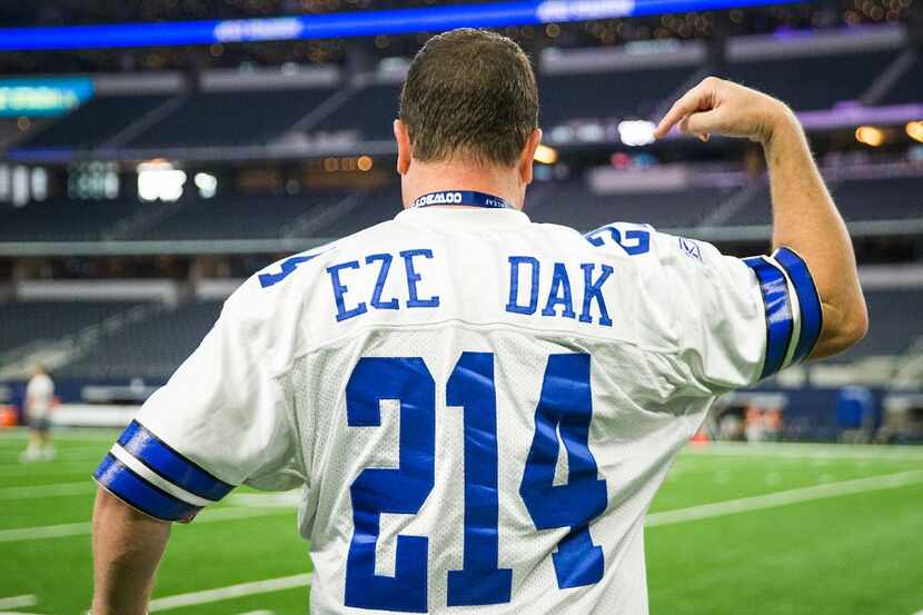 Dallas Cowboys fan Brad Holden wears a shirt with both the names and numbers of running back...