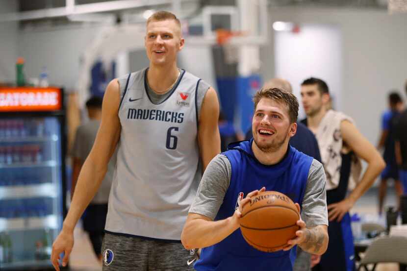 Dallas Mavericks forward Luka Doncic (77) prepares to shoot a three pointer as Dallas...