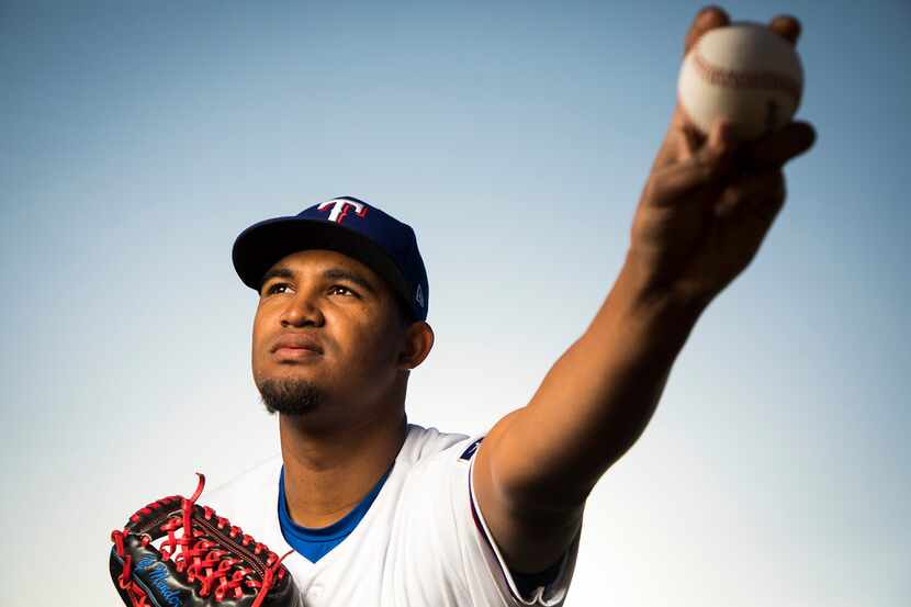 Texas Rangers pitcher Yohander Mendez poses for a photo during Spring Training picture day...