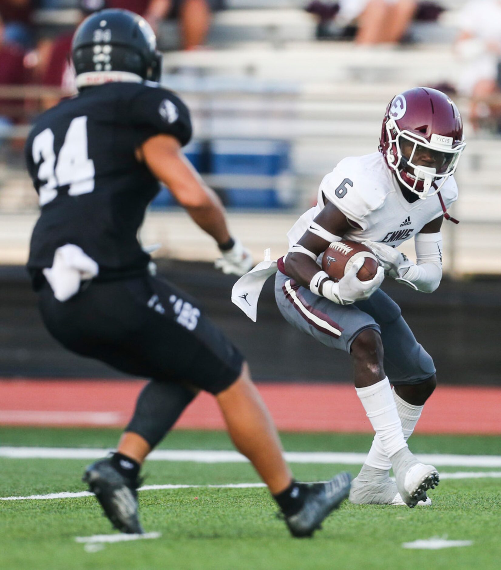 Ennis wide receiver Karon Smith (6) breaks past Bishop Lynch defensive back James Quezada...