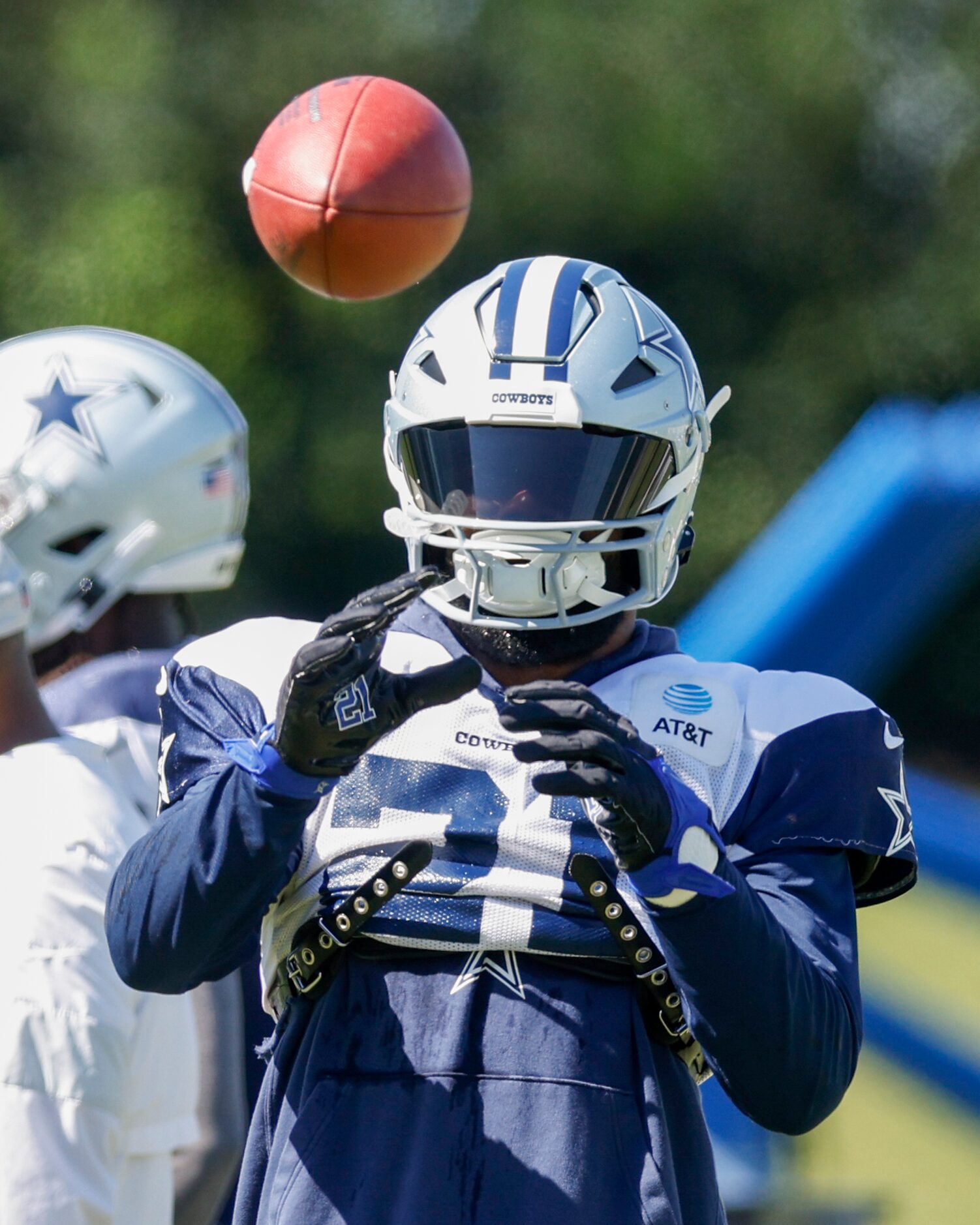 Dallas Cowboys running back Ezekiel Elliott (21) catches a pass during a practice at The...