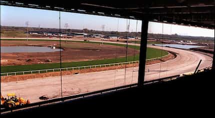 The horse barns can be seen in the distance from the third level of the grand stand where...
