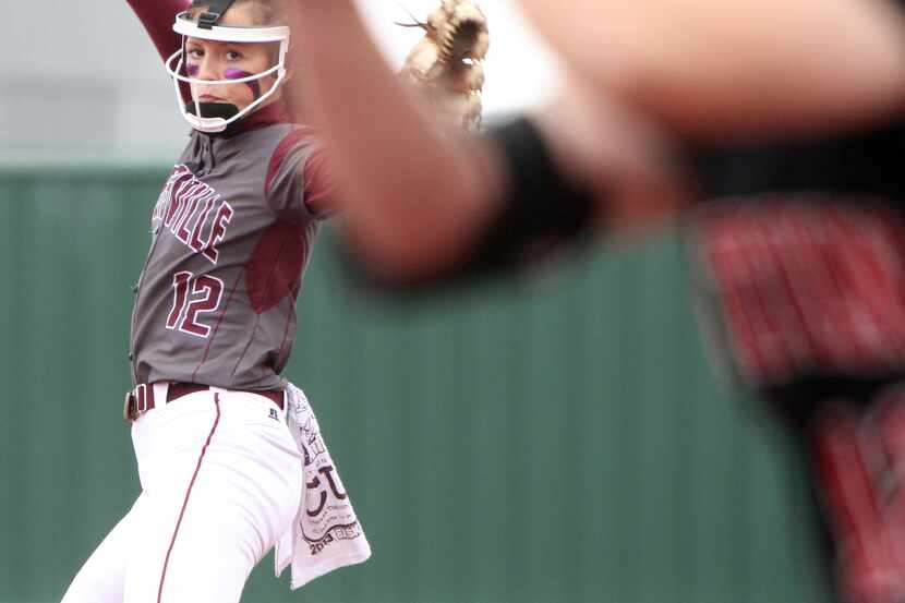 Lewisville pitcher Maribeth Gorsuch (12) delivers a pitch to an Arlington Martin batter...