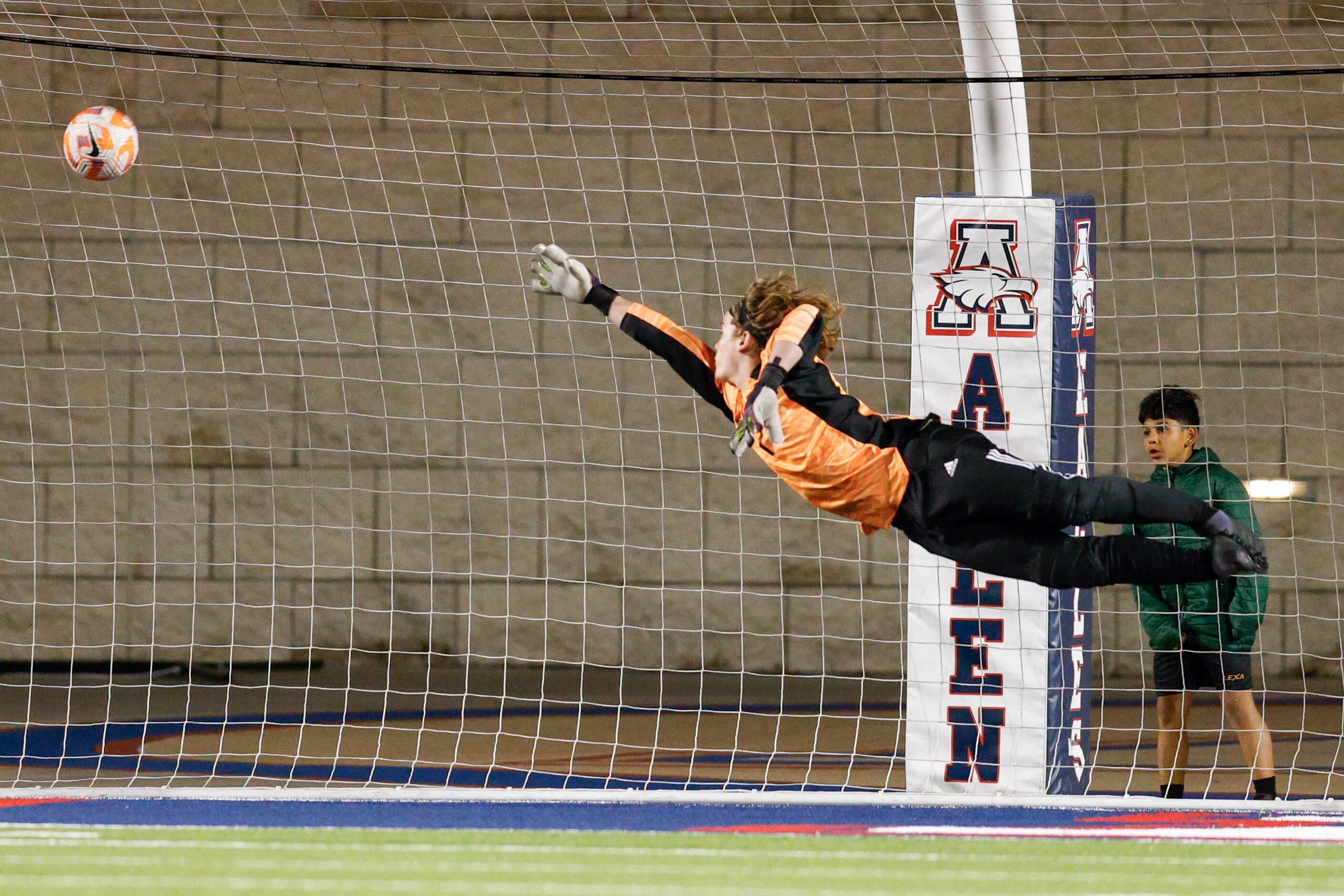 Prosper goalkeeper Paxton Bradley (1) watches as a shot from Allen’s Zayan Ahmed scores...