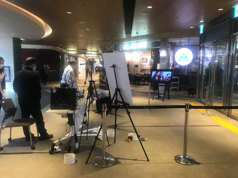 Shoppers are scanned before entering stores and malls in Seoul.