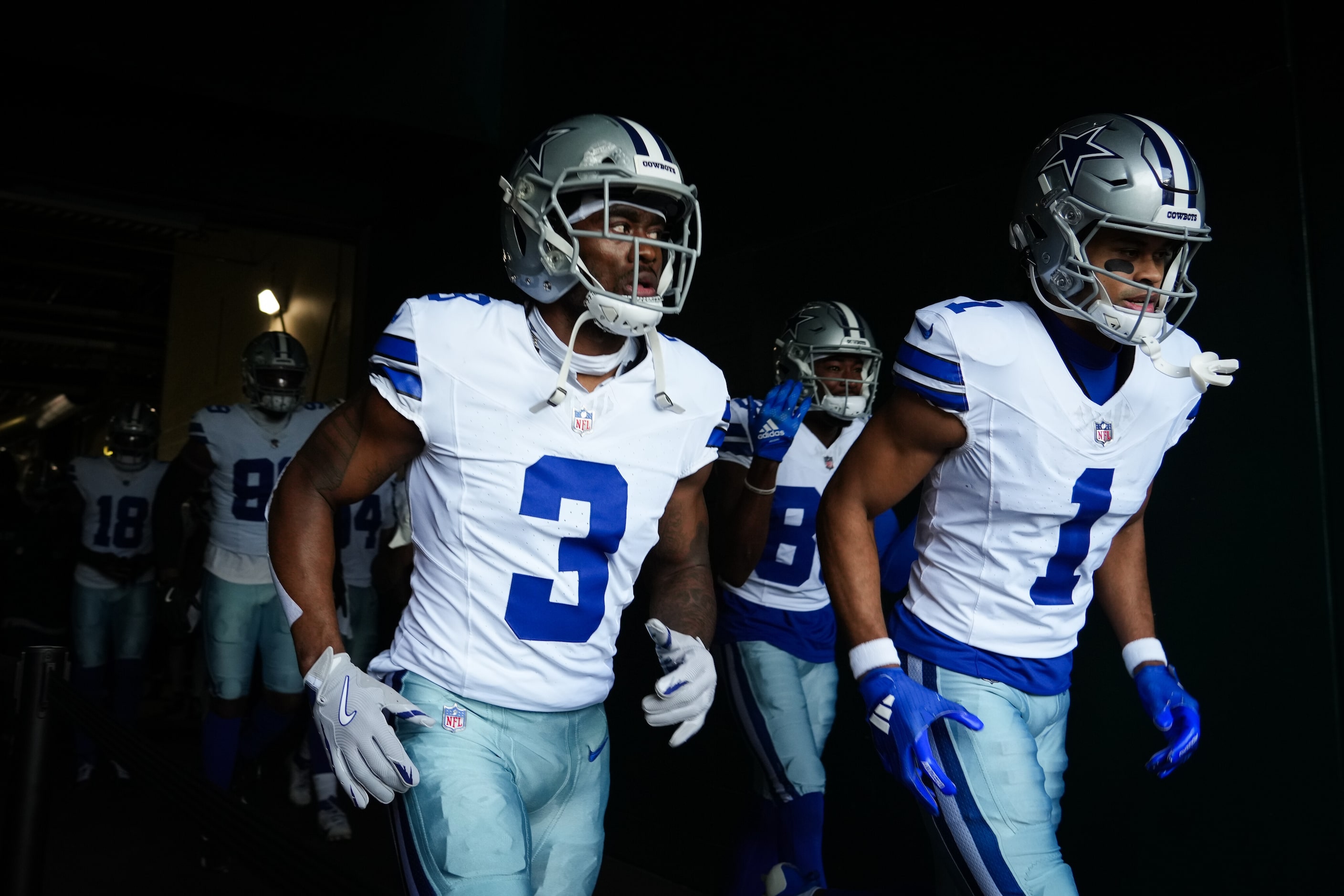 Dallas Cowboys wide receivers Brandin Cooks (3) and Jalen Tolbert (1) take the field before...