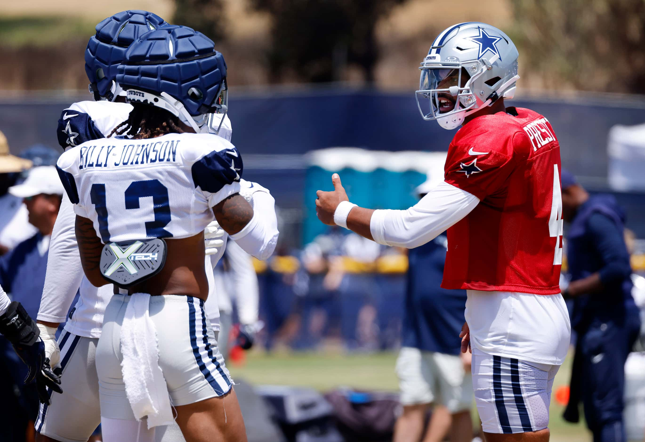 Dallas Cowboys quarterback Dak Prescott (4) corrects a mistake made by wide receiver Tyron...