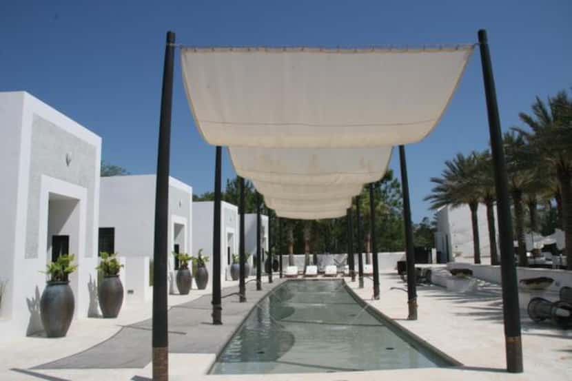 Alys Beach’s Caliza Pool, with its upscale water features, gourmet restaurant and bar, is...