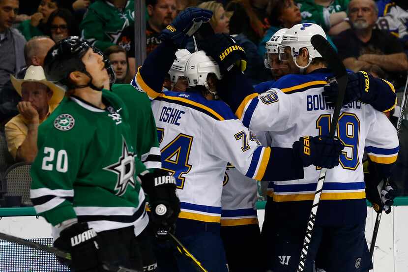 St. Louis Blues wing T.J. Oshie (74) and defenseman Jay Bouwmeester (19) celebrate their...