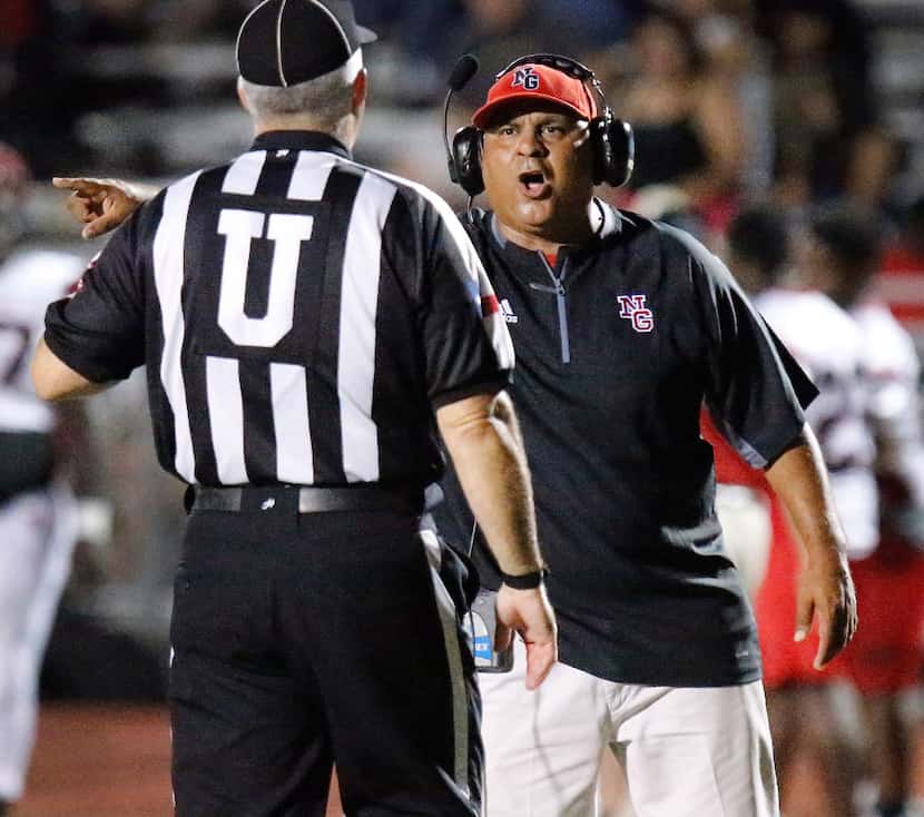 North Garland High School head coach Joe Castillo lets a referee know his opinion on a...