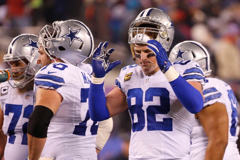 Dallas Cowboys tight end Jason Witten (82) puts his helmet on during a time out in the...
