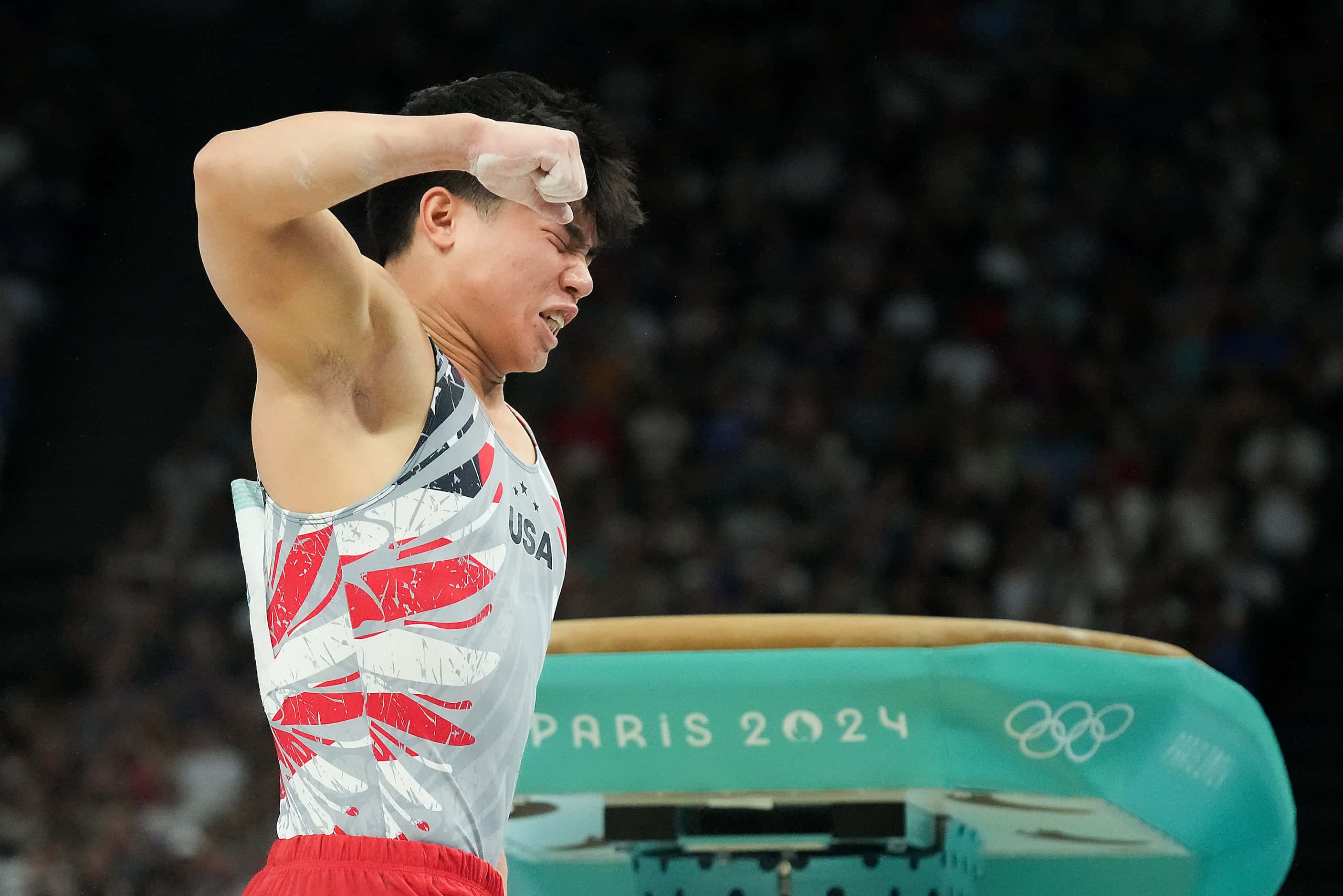 Asher Hong of the United States reacts after competing on the vault during the men’s...