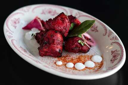 Anari chicken is made with pomegranate seeds, yogurt, ginger, chili and fenugreek at Âme.