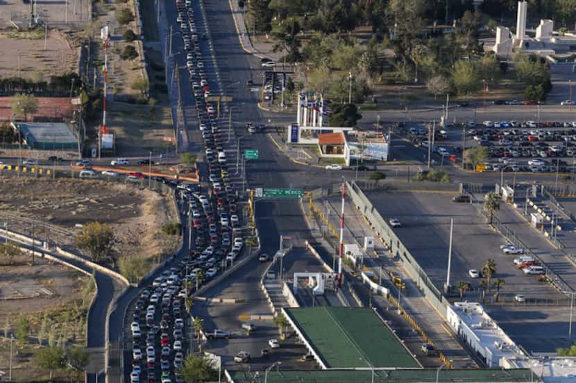 Cars line up to enter the United States through the Bridge of the Americas Port of Entry in...