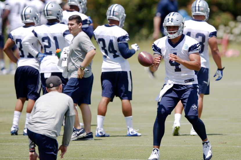 Dallas Cowboys Dak Prescott (4) prepares to catch the ball on a play during rookie minicamp...