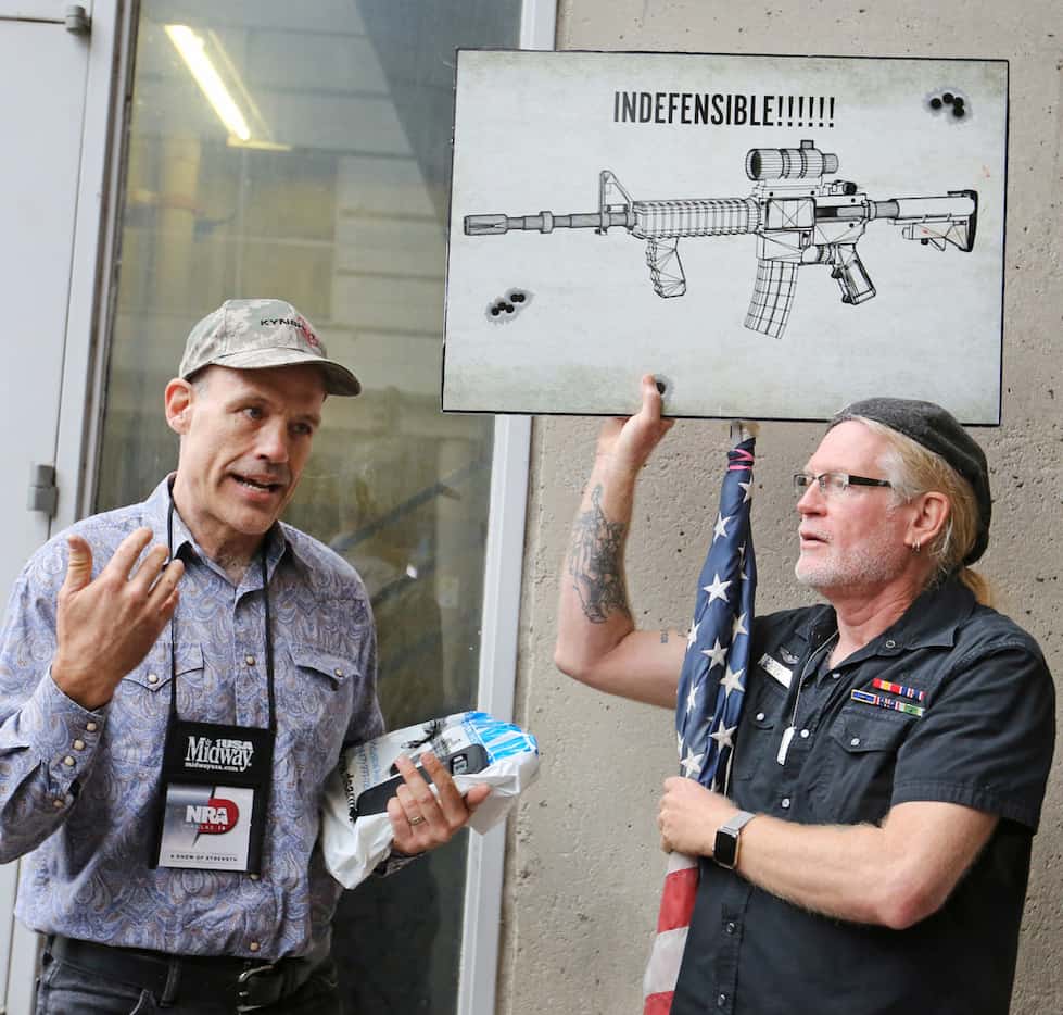 Jim Whalen of West Palm Beach, Fla., a gun proponent, talked civilly with protester David...