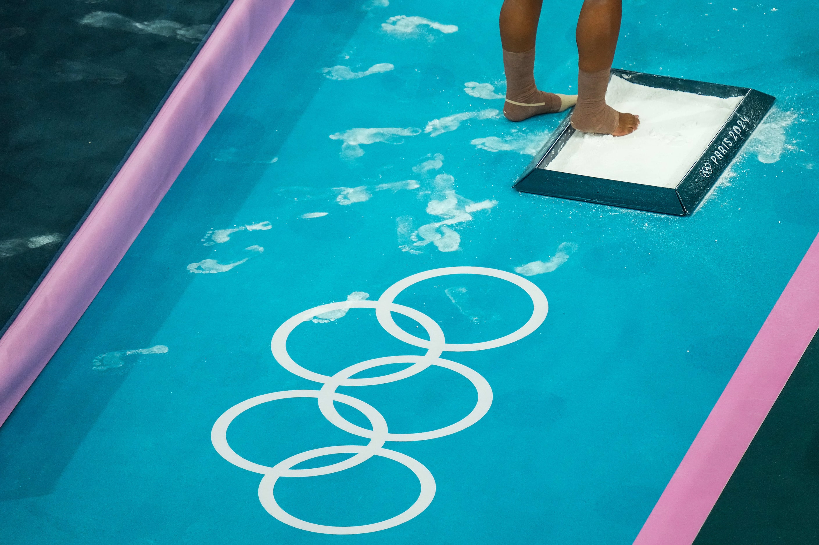 Jordan Chiles of the United States steps into a chalk box before she competes on the floor...